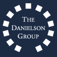 Logo of The Danielson Group featuring the name in a modern font surrounded by circular elements on a dark blue background.